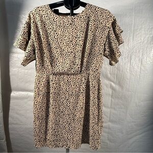 She + Sky Tan Flutter Sleeve Sheath Dress with open back.